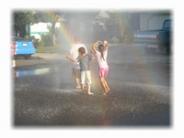 Three Kids Playing In A Double Rainbow
