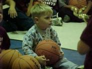 Toddler Sitting With Basketball