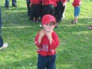 Toddler In Red Baseball Gear